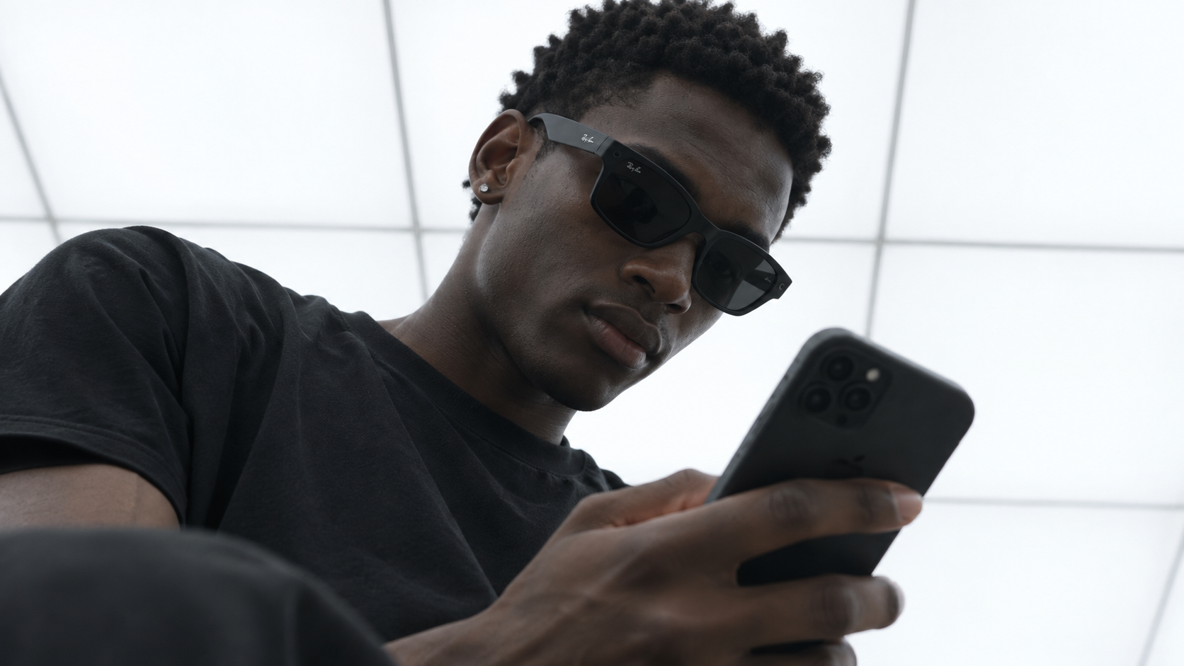 Recognition Assistance: a user in AR glasses checking a phone
